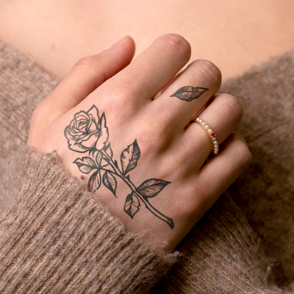 Girl with rose tattoo by Taranis Tribe | Post 30508