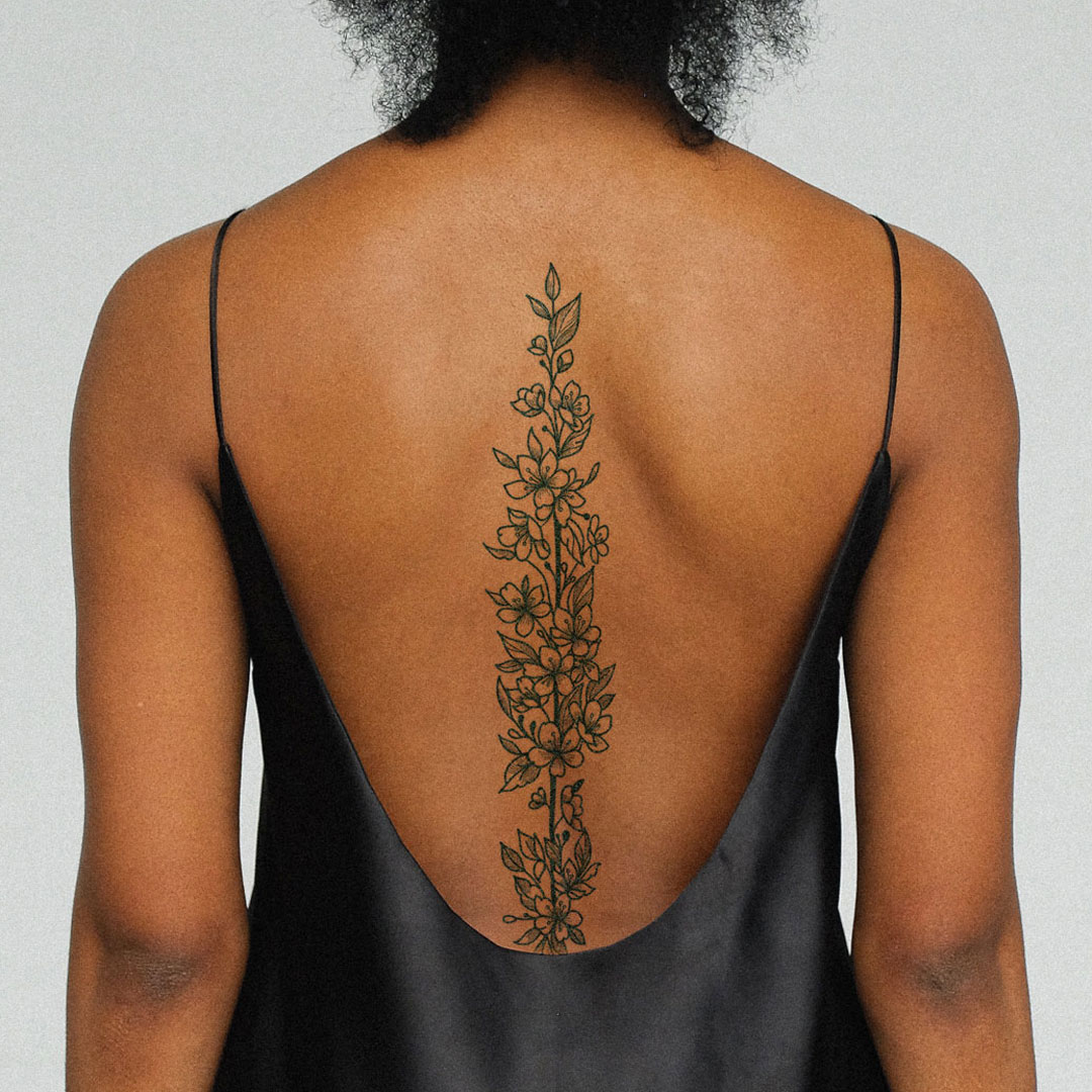 Full back woman tattoo with a lioness, stars, water lily, coi fi... -  Arthub.ai